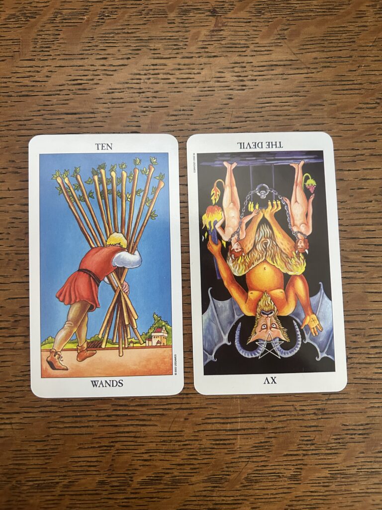 Tarot cards, ten of wands, the devil reversed